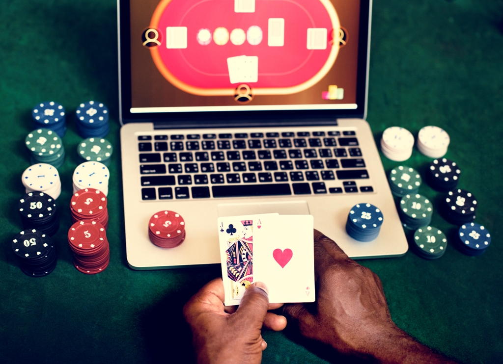 hand-holding-card-playing-online-gambling